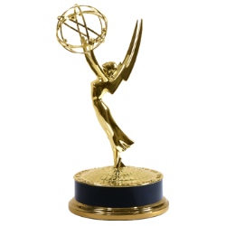 The Emmys statue is a golden angel with wing tips reaching up while she holds a circular shape representing an atom above her head. 