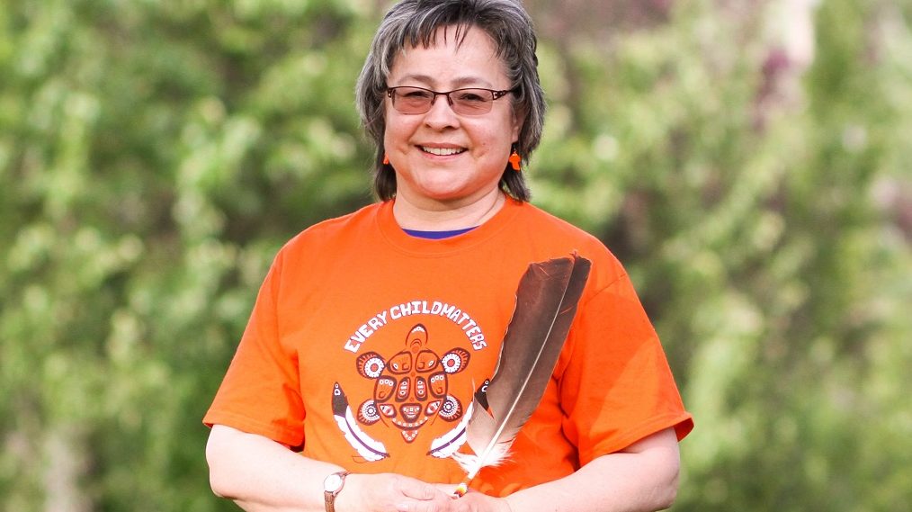 Phyllis Webstad in an orange shirt