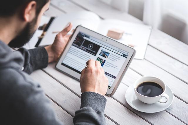 A man using an iPad