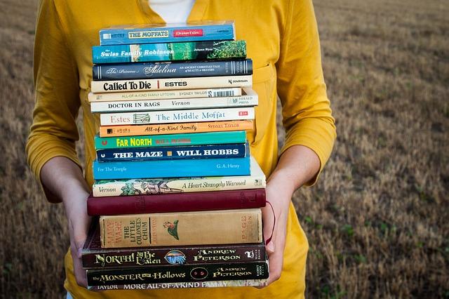 woman with a stack of books