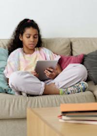 Girl reading on tablet